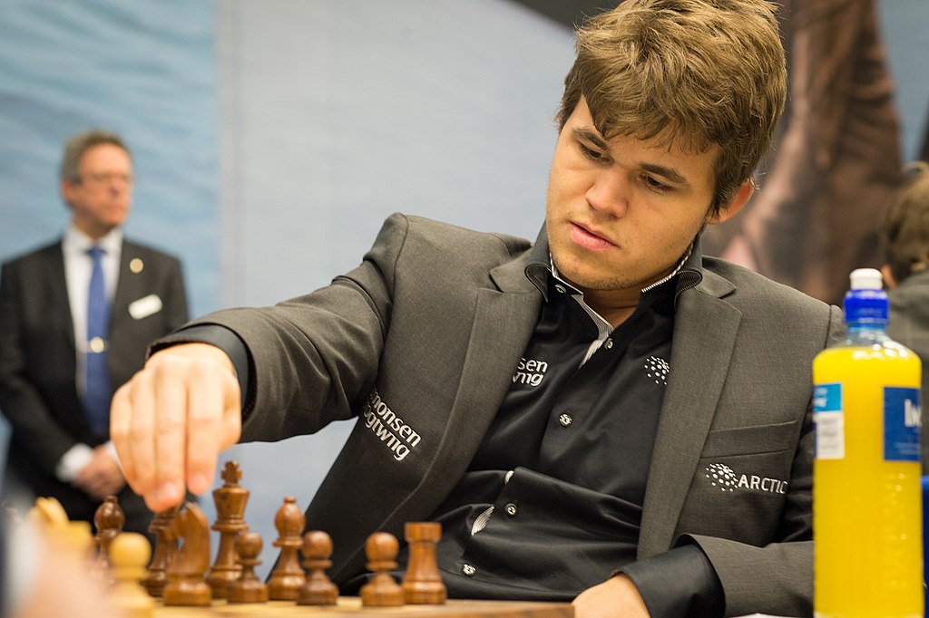 Magnus Carlsen playing a chess game with the black pieces in 2013